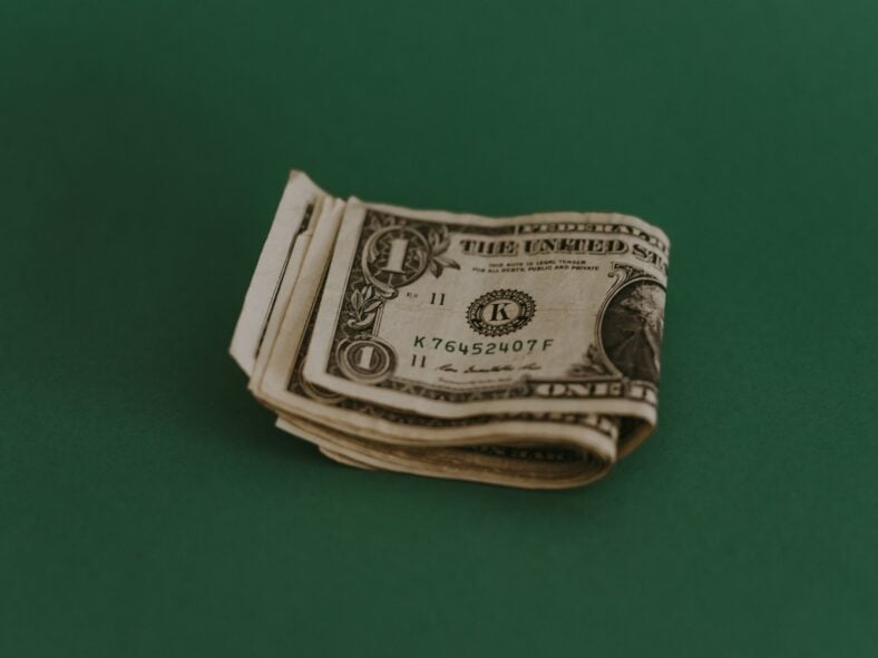 dollar bills on green background