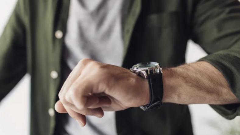 man's wrist with a watch