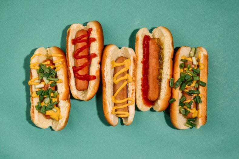 hot dogs with various toppings