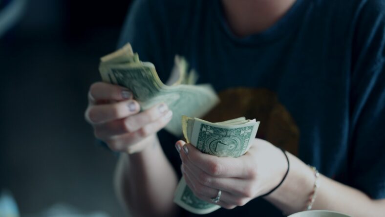 woman counting out money