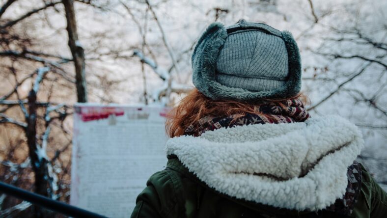woman in a hat and winter coat / costco winter clothing