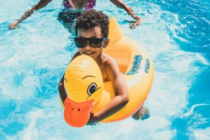 kid in a pool floatie / costco pool products