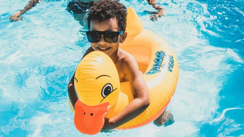 kid in a pool floatie / costco pool products