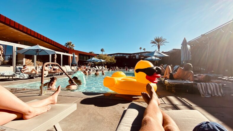 people siting at a pool / costco swimwear